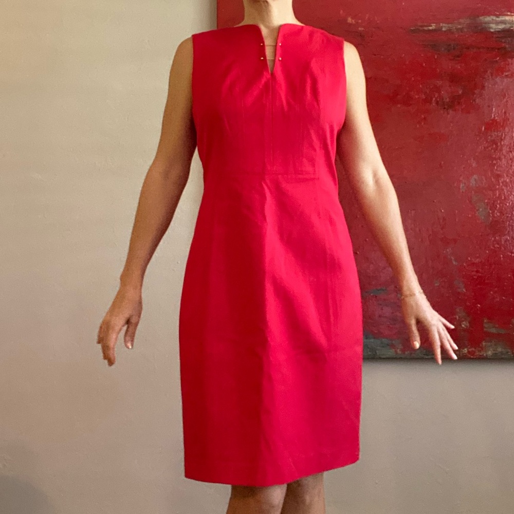 Ellie Tahari red dress with gold detail at chest. Size 10.